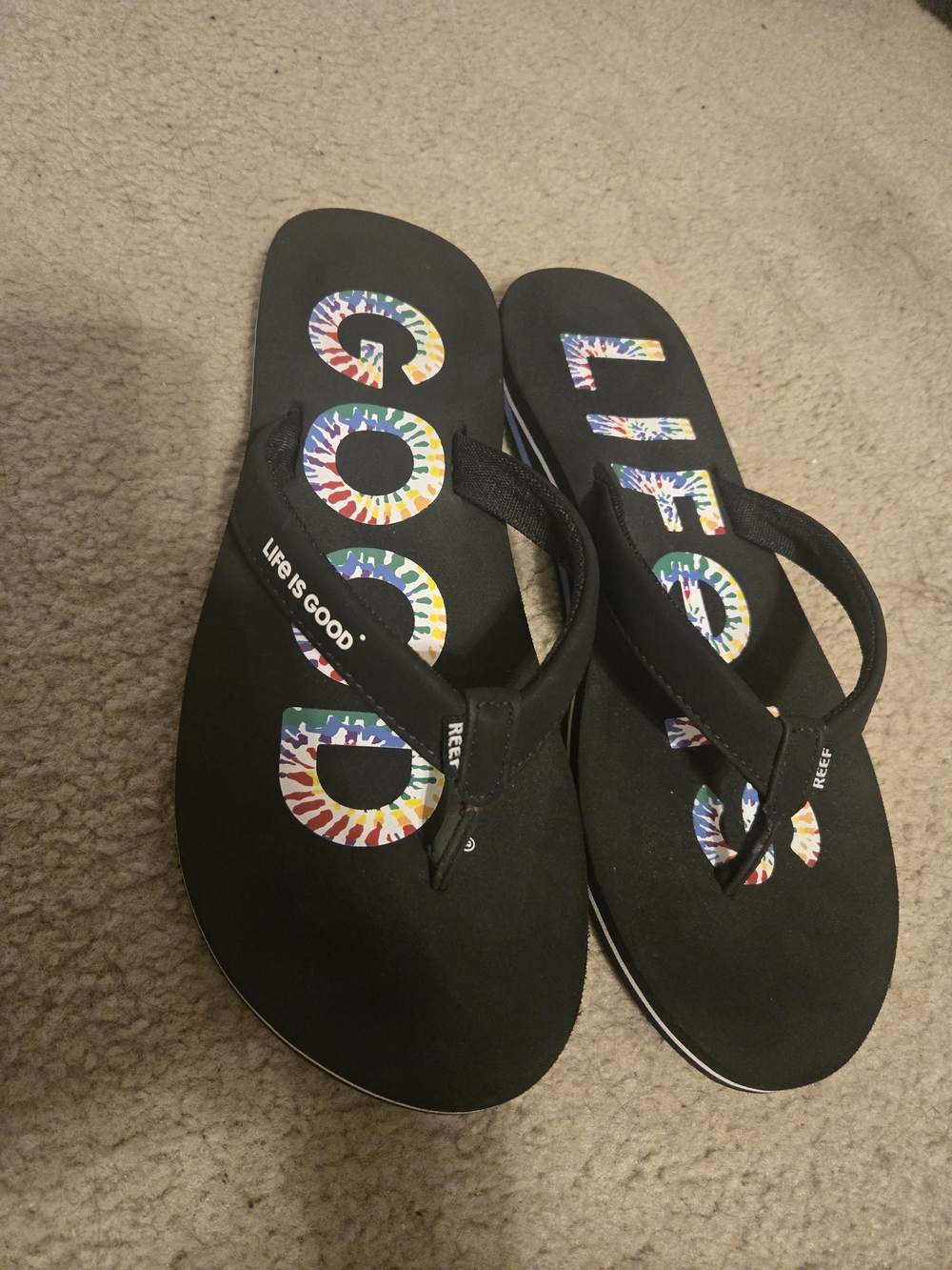 REEF/Life Is Good Black Flip Flops with Multicolor Tie-Dye Logo